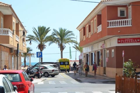 Property building, Day, Neighbourhood, Natural landscape, Beach, City view, Street view, Location, Parking