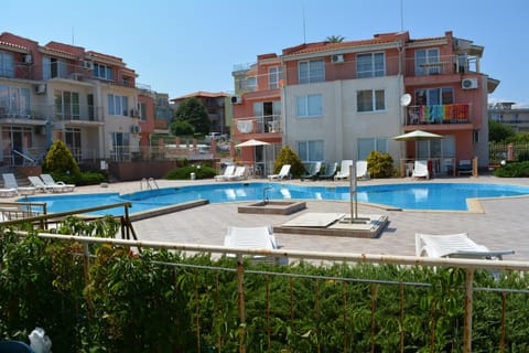 Property building, Patio, Pool view, Swimming pool, sunbed