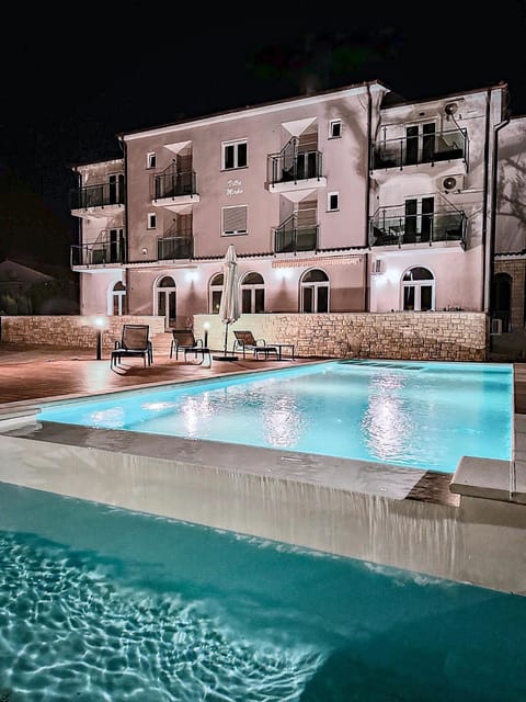 Property building, Night, Pool view, Swimming pool, sunbed