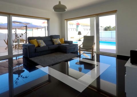 Living room, Seating area, Pool view