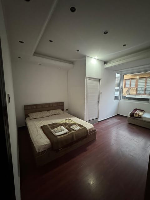 Bed, Living room, Seating area, Bedroom