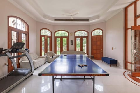 StayVista's Krishnalaya Mansion, featuring an Indoor swimming pool, Jacuzzi, Sauna, Indoor games & A lush lawn for your enjoyment Villa in Jaipur