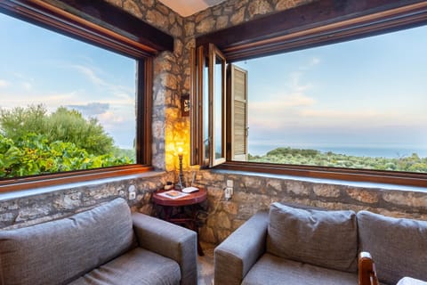 View (from property/room), Living room, Seating area, Mountain view, Sea view