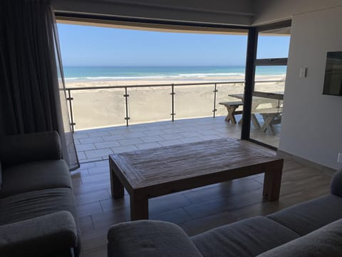 View (from property/room), Living room, Seating area, Beach, Sea view