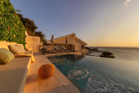 Property building, Natural landscape, Seating area, Pool view, Sea view, Swimming pool, Sunset, sunbed