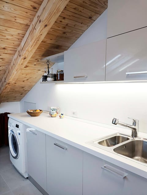 Kitchen or kitchenette, washing machine