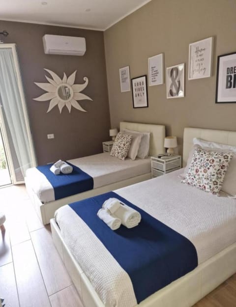 Bed, Photo of the whole room, Bedroom, towels, air conditioner