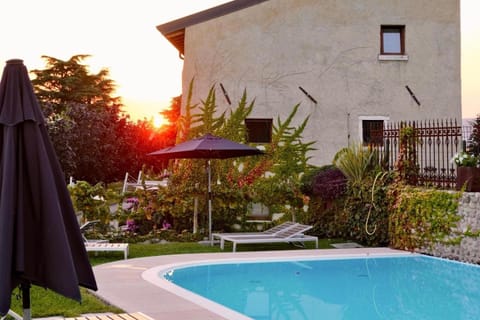 Property building, Swimming pool, Sunset