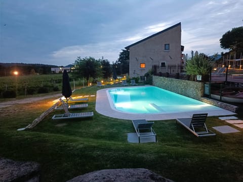 Property building, Night, Natural landscape, Pool view, Swimming pool, sunbed