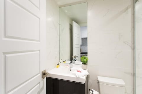 Serene and Styled Little Italy Studio full bath by Den Stays Apartment in Laval