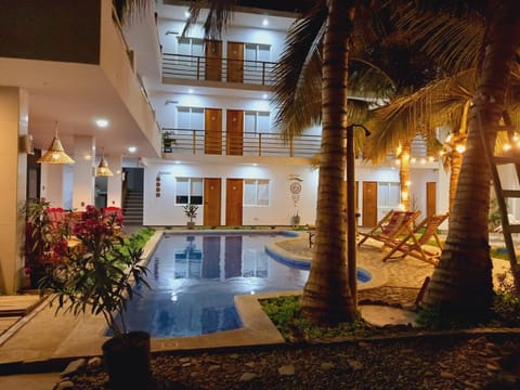 Patio, Night, Seating area, Pool view, Swimming pool, sunbed