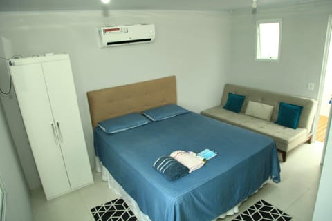 Bed, Living room, Seating area, Bedroom, towels, air conditioner