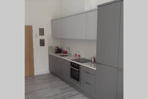 Kitchen or kitchenette, dishwasher, oven, stove