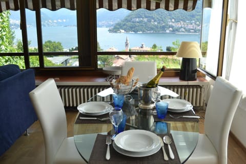 Natural landscape, View (from property/room), Living room, Seating area, Dining area, Lake view