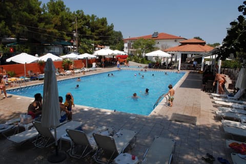 Property building, Day, Pool view, group of guests