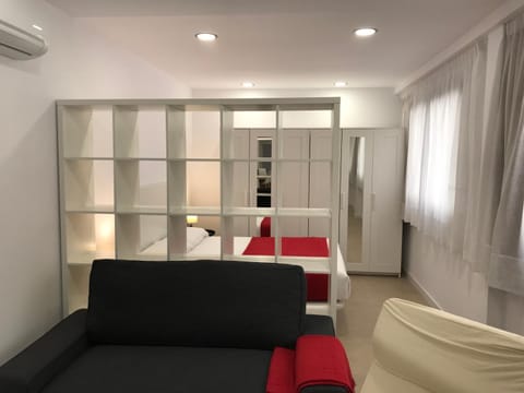 Bed, Living room, Seating area, Bedroom, air conditioner