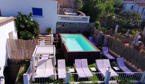 Property building, Patio, Pool view, Swimming pool, sunbed