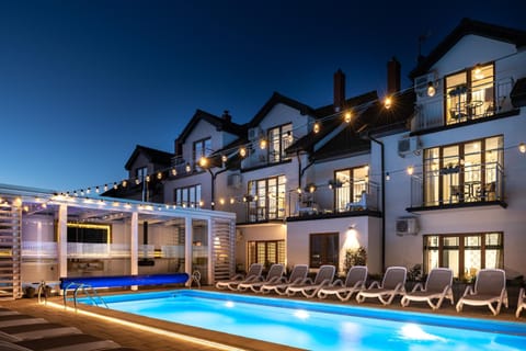 Property building, Night, Seating area, Pool view, Swimming pool