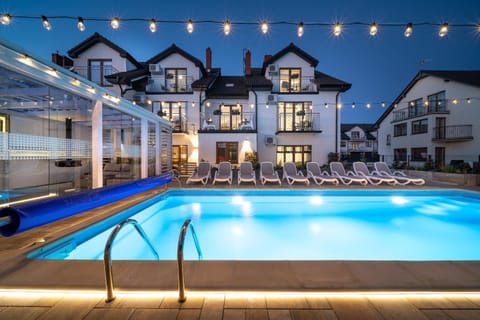 Property building, Night, Seating area, Pool view, Swimming pool, sunbed