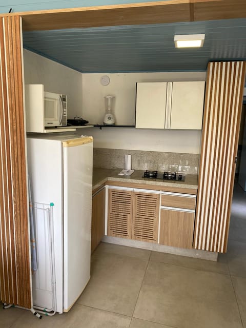 Photo of the whole room, Dining area, minibar, stove, kitchen