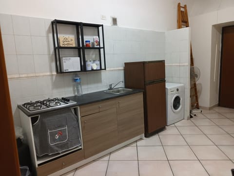 Kitchen or kitchenette, stove, washing machine