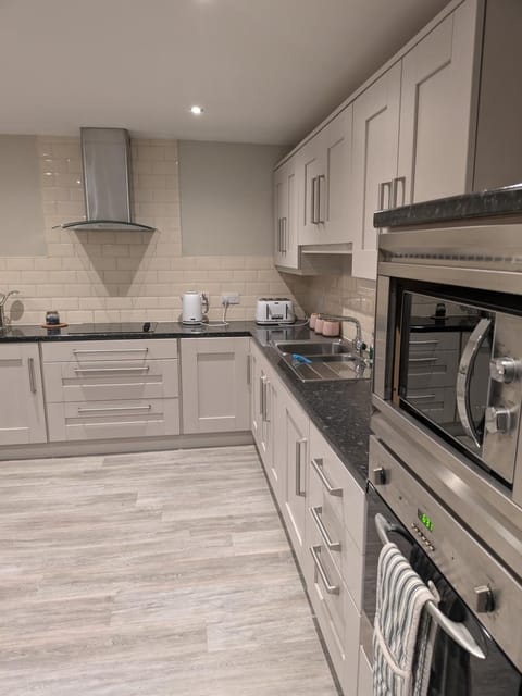 Kitchen or kitchenette, stove, toaster