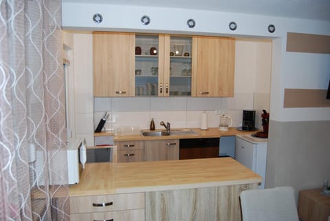 Kitchen or kitchenette, stove, towels, kitchen