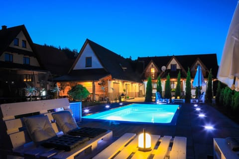 Property building, Patio, Night, Natural landscape, Pool view, Swimming pool, sunbed