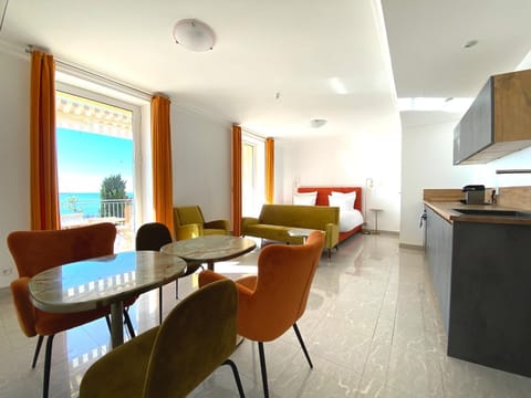 Communal lounge/ TV room, Bed, Living room, Seating area, Dining area, Sea view, kitchen