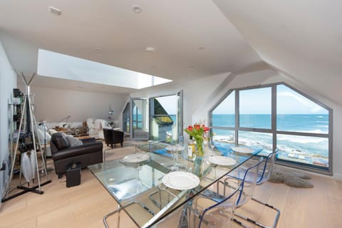View (from property/room), Living room, Seating area, Dining area, Sea view