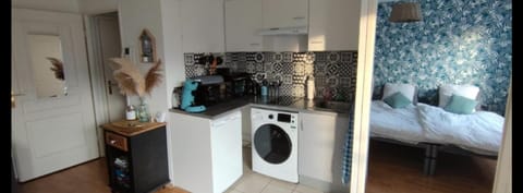Kitchen or kitchenette, oven, stove, toaster, washing machine