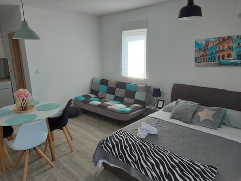 Bed, Living room, Seating area, Bedroom