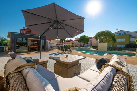 Property building, Patio, Natural landscape, Garden, Seating area, Garden view, Pool view, Swimming pool, sunbed