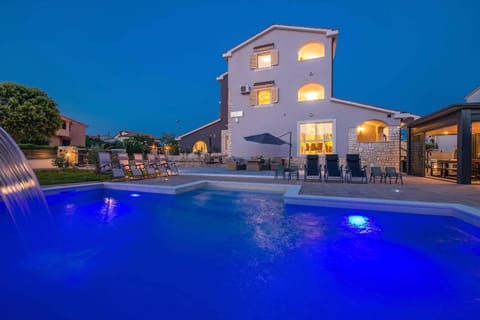 Property building, Patio, Night, Pool view, Swimming pool, sunbed