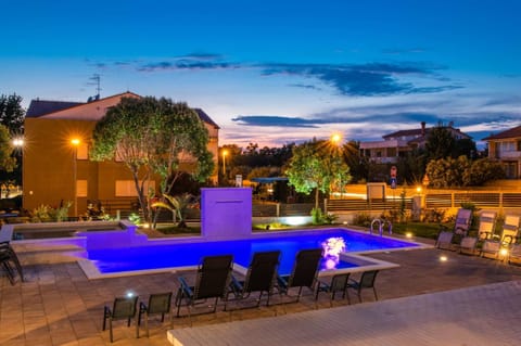 Property building, Patio, Night, Natural landscape, Pool view, Swimming pool