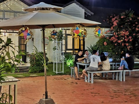 Patio, Night, People, Dining area, group of guests