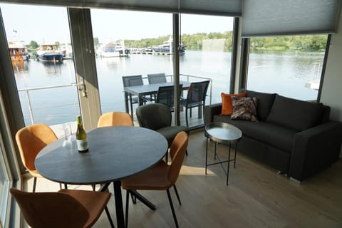 View (from property/room), Living room, Seating area, Dining area, Lake view