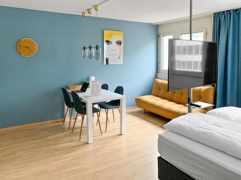 Bed, TV and multimedia, Living room, Seating area, Dining area