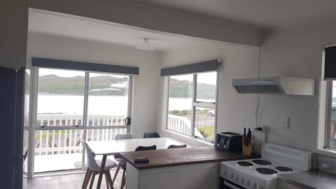 Karoro the beach front bach with views to die for! House in Raglan