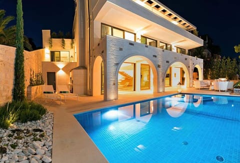 Property building, Patio, Night, Balcony/Terrace, Pool view, Swimming pool, sunbed