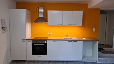 Kitchen or kitchenette, dishwasher, oven, stove