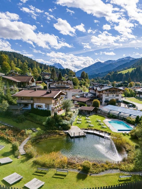 Property building, Natural landscape, Bird's eye view, Lake view, Mountain view, Pool view, Swimming pool