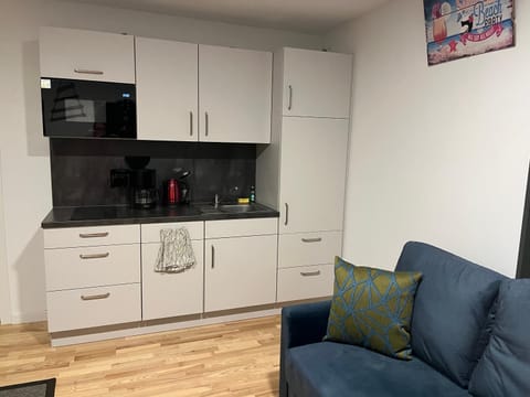 Kitchen or kitchenette, Living room, Seating area, stove