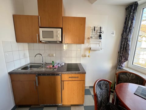 Kitchen or kitchenette, stove, toaster