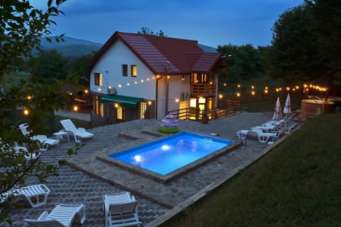 Property building, Night, Natural landscape, Mountain view, Pool view, Swimming pool, sunbed