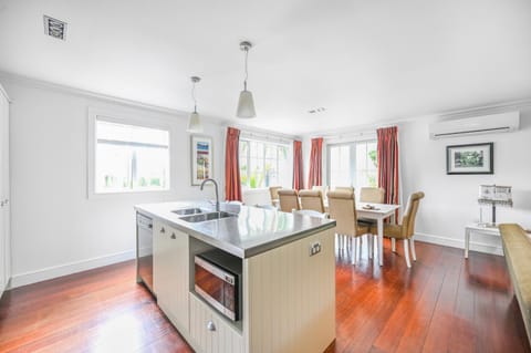 Living room, Dining area, dishwasher, microwave, oven, stove, kitchen