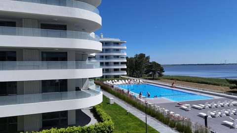 Property building, Day, Natural landscape, Pool view, Sea view, Swimming pool, sunbed