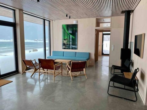 TV and multimedia, View (from property/room), Living room, Seating area, Beach, Sea view