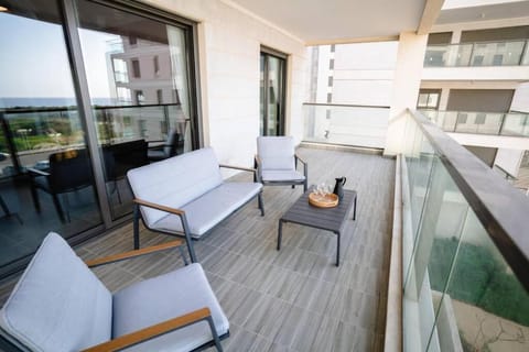 Modern with Balcony Over Looking the Sunset & the Sea by Sea N' Rent Condo in North District
