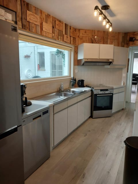 Kitchen or kitchenette, dishwasher, oven, stove